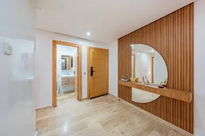 a bathroom with a sink and a mirror at Luxueux appartement -70 haut gamme Guéliz in Marrakech