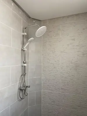 a shower with a shower head in a bathroom at Marrakech Dar El Hijazi 2 in Marrakech