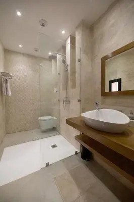 a bathroom with a sink and a glass shower at Villa zen in Marrakech