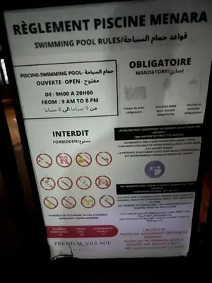 a sign that says retirement pressure membraneivating poolysis istg at Premuim village Marrakech in Marrakech