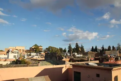 a view of a city from the roof of a building at Riad MONDRIAH in exclusivity only for you in Marrakech