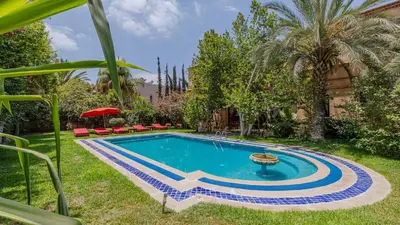 a swimming pool in the yard of a house at la villa du golf in Sfiani