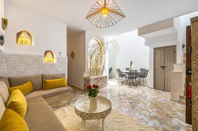 a living room with a couch and a table at Riad Symba Exclusive with New Heated Pool and Breakfast Included in Marrakech