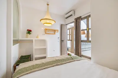 a bedroom with a bed and a window at Riad Symba Exclusive with New Heated Pool and Breakfast Included in Marrakech