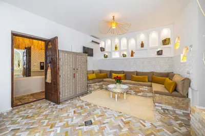 a living room with a couch and a table at Riad Symba Exclusive with New Heated Pool and Breakfast Included in Marrakech