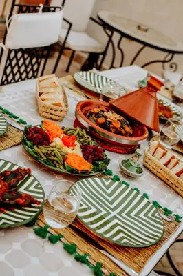 a table with plates of food on top of it at Dar Inara in Marrakech