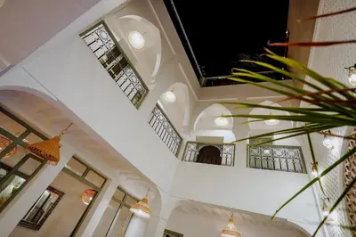 a building with a ceiling with windows and a plant at Dar Inara in Marrakech