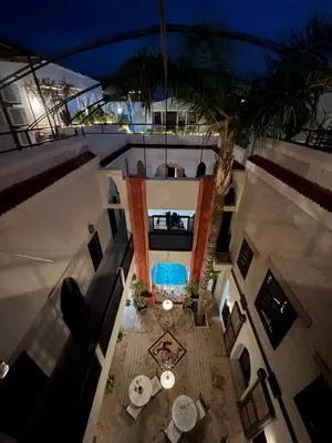 an overhead view of a building with a pool at Riad 5 sens in Marrakech
