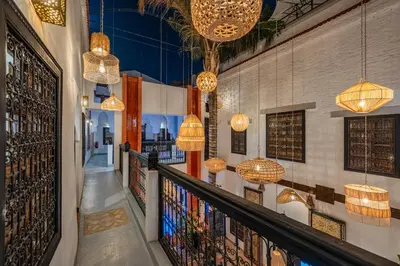 a hallway in a wine cellar with hanging lights at Riad 5 sens in Marrakech