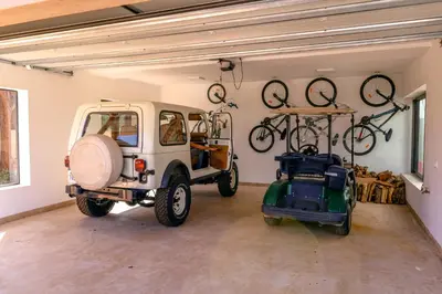 a garage with bikes hanging on the wall at Villa Angel 42 Al Maaden Golf Resort in Marrakech