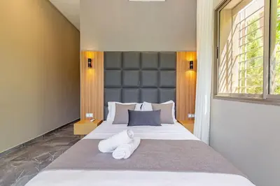 a bedroom with a large bed with white towels on it at Villa Narjisse , Élégance et Calme, piscine privée in Marrakech