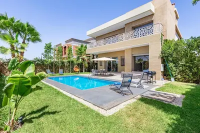 a house with a swimming pool in the yard at Villa Narjisse , Élégance et Calme, piscine privée in Marrakech