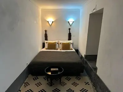 a bedroom with a bed in a room at Dar Hatim in Marrakech