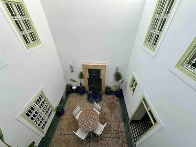 an overhead view of a room with a table and chairs at Dar Hatim in Marrakech