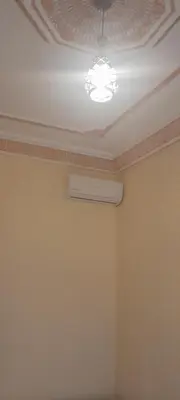 a room with a white ceiling and a ceiling fan at Riad Ramadan House Marrakech in Marrakech