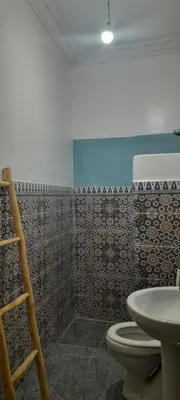 a bathroom with a toilet and a sink at Riad Ramadan House Marrakech in Marrakech