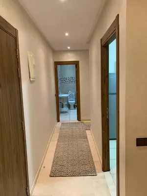 an empty hallway with a door and a carpet at Nour5 in Marrakech
