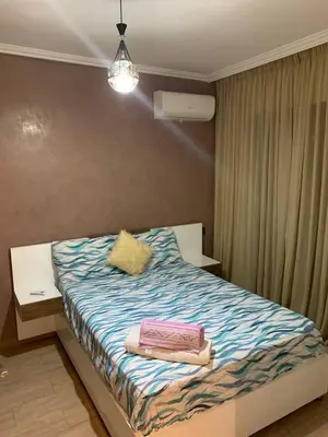 a bedroom with a bed with towels on it at Nour5 in Marrakech