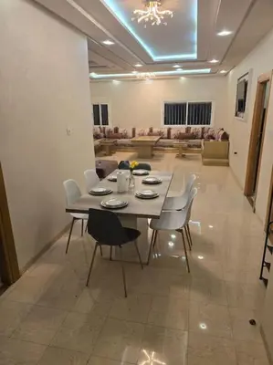a dining room with a table and chairs in a room at Marrakech-Central location 2 Bdrm in Marrakech