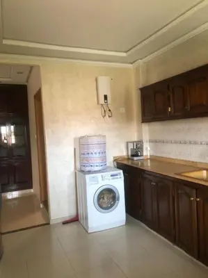 a kitchen with a washing machine with a stack of boxes on it at Marrakech-Central location 2 Bdrm in Marrakech