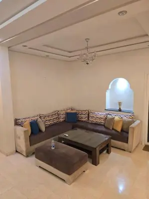 a living room with a couch and a coffee table at Marrakech-Central location 2 Bdrm in Marrakech