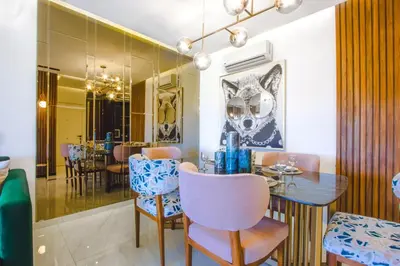 a dining room with a table and chairs at Appartement prestigia Jad in Marrakech