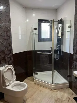 a bathroom with a shower and a toilet at شقق جيليز in Marrakech