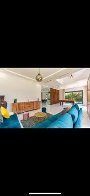 a large living room with a large blue couch at Beautiful villa Argan golf in El Makina