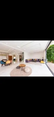 a living room with a table and a dining room at Beautiful villa Argan golf in El Makina