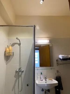 a bathroom with a shower and a sink at Cosy & chill home in Marrakech