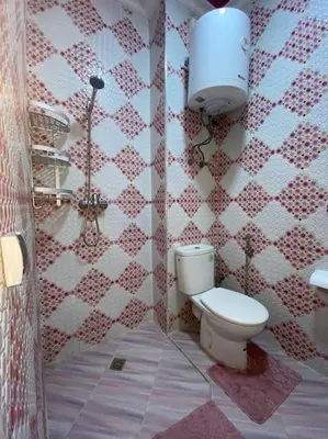 a bathroom with a toilet and a sink at Appart élégance Gueliz in Marrakech