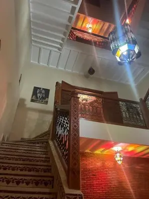 a staircase in a building with a stained glass ceiling at Al Qaria Assiyahia Riad Fadil 44 in Marrakech