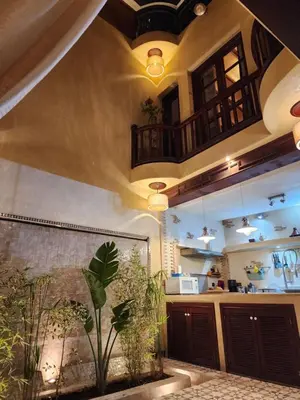 a room with a kitchen with a plant in it at Riad Mumtaz Marrakech in Marrakech