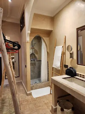 a master bathroom with a shower and a sink at Riad Mumtaz Marrakech in Marrakech