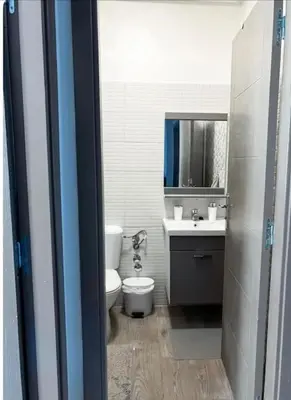 a bathroom with a toilet and a sink at Proche Gueliz T3 Piscine Parking Wifi in Marrakech