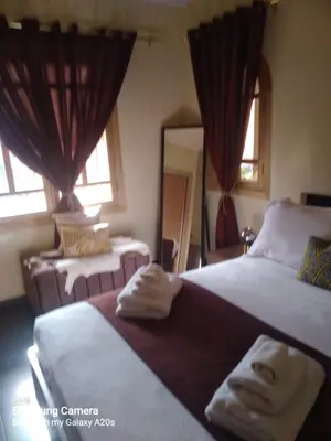 a bedroom with two beds with towels on them at اقامة حمزة in Marrakech