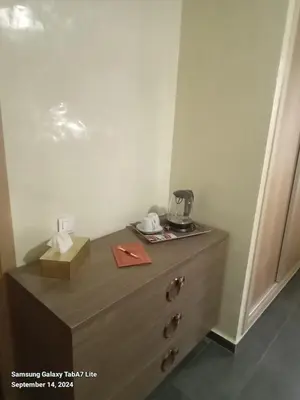 a dresser with a coffee maker on top of it at اقامة حمزة in Marrakech