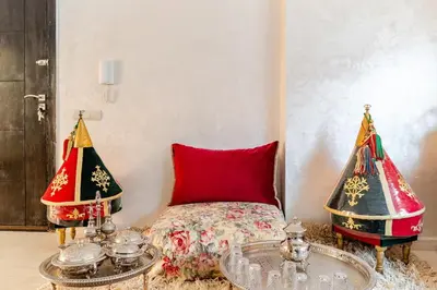 a room with a bed and two christmas trees at Duplex romantique Esprit palais à Gueliz in Marrakech