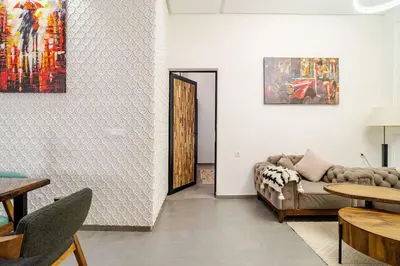 a living room with a couch and a table at Villa michlo in El Makina