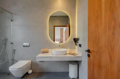 a bathroom with a sink and a mirror at Villa Piscine, Salle de Sport et Confort Moderne in Marrakech