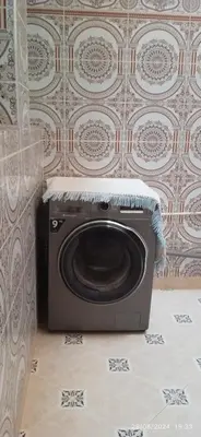a washing machine in a room with a wall at Nassim 298 in Marrakech