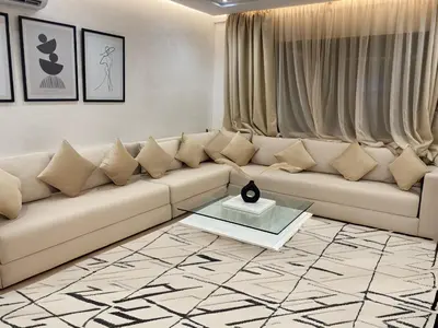 a living room with a couch and a table at Haut standing coeur Gueliz in Marrakech