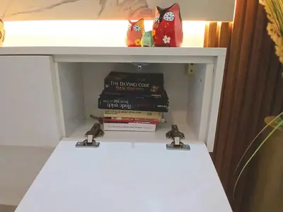 a book shelf with books on top of it at Cozy studio in Marrakech district in Marrakech