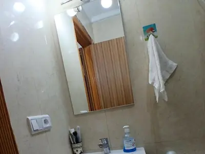 a bathroom with a sink and a mirror and a shower at Cozy studio in Marrakech district in Marrakech
