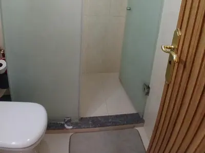 a small bathroom with a shower with a toilet at Cozy studio in Marrakech district in Marrakech