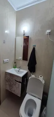 a bathroom with a white toilet and a sink at Cozy studio in Marrakech district in Marrakech