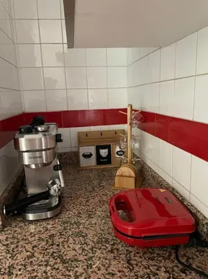 a kitchen with a counter top with a red appliance at Stylish & Comfy Gem 5 Star Location Balcony in Marrakech