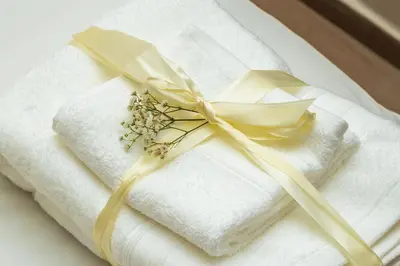 a bunch of towels with a yellow ribbon on them at Boho Haven Hivernage - Plein centre ville in Marrakech