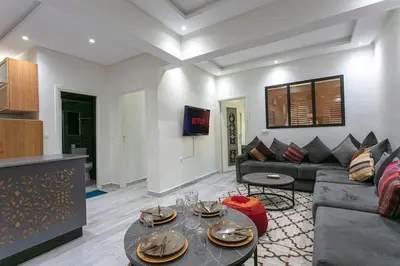 a living room with a couch and a table at A Touch of Marrakchi Magic - Marrakech in Marrakech