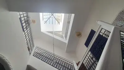 an overhead view of a staircase with a window at RIAD Le shams in Marrakech